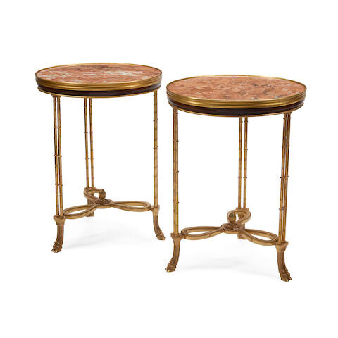 A PAIR OF MARBLE AND GILT BRONZE MOUNTED MAHOGANY GUÉRIDONS