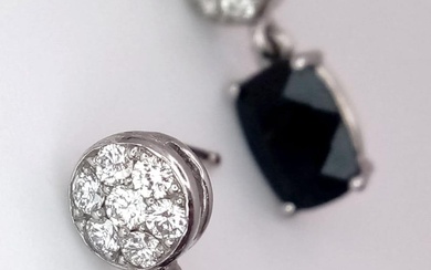 A Pair of 18K Diamond and Onyx Earrings. Diamond...