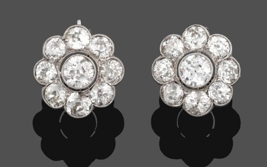 A Pair of Diamond Cluster Earrings, an old cut diamond...