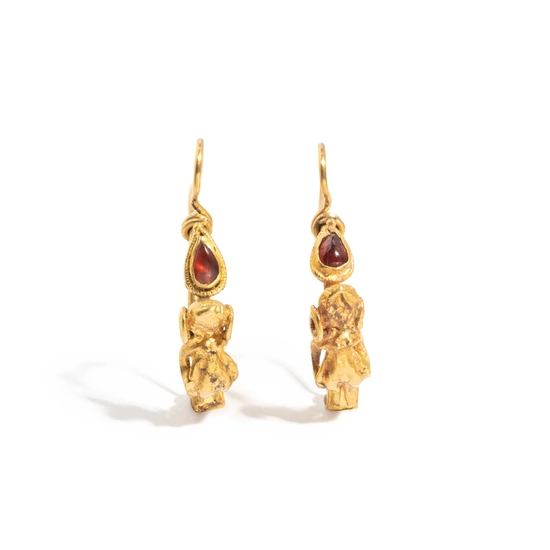 A Pair of Hellenistic Gold and Garnet Earrings with the God Eros