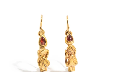 A Pair of Hellenistic Gold and Garnet Earrings with the God Eros