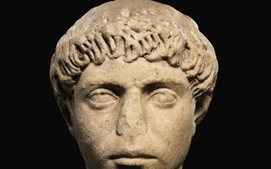 A ROMAN MARBLE PORTRAIT HEAD OF A YOUNG MAN, HADRIANIC, CIRCA A.D. 130-140