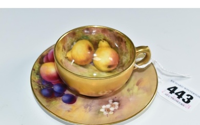 A ROYAL WORCESTER FALLEN FRUITS SMALL TEACUP AND SAUCER, the...