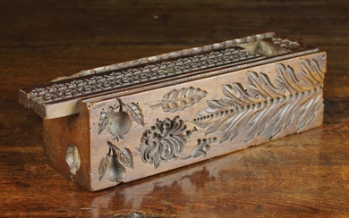 A Rare Antique Dug-out Treen Mould Box. The long, square section fruitwood block carved on all sides