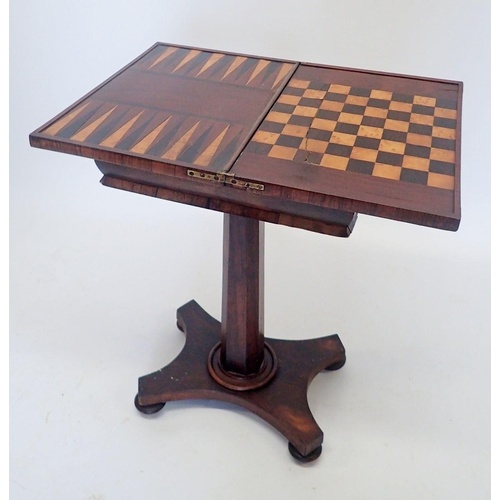A Regency rosewood fold top games table with inlaid chess an...