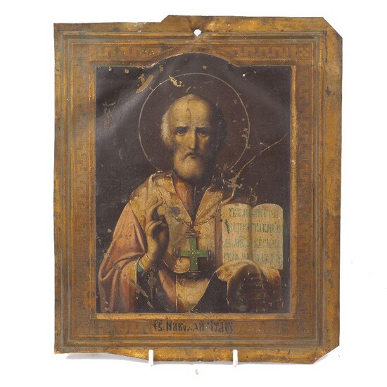 A Russian icon of Saint Nicholas, late 19th Century, with open book and right hand blessing, painted and parcel gilt on brass panel, 29cm x 24cm