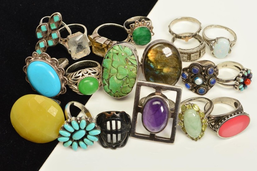 A SELECTION OF NINETEEN MAINLY GEM SET SILVER AND WHITE META...