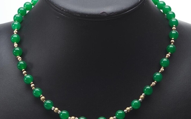 A STRAND OF DYED GREEN JADE BEADS, CLASP IN 9CT GOLD, TOTAL LENGTH 45CMS