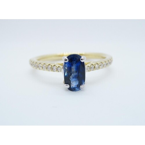 A Sapphire and Diamond Ring claw-set oval-cut sapphire, 0.94...