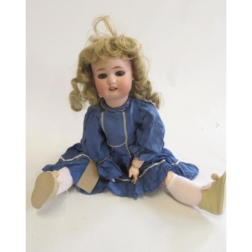 A Simon & Halbig bisque socket head doll with blue glass sle...