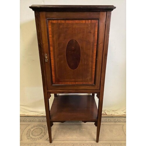 A TALL INLAID MAHOGANY ONE DOOR CABINET, with crossbanding, ...
