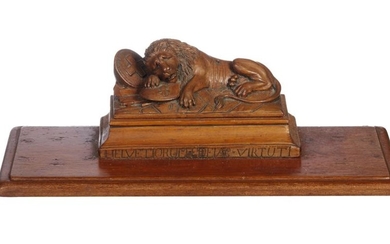 A VICTORIAN CARVED WOODEN INKSTAND ON A BASE AFTER THE 'LION OF LUCERNE'