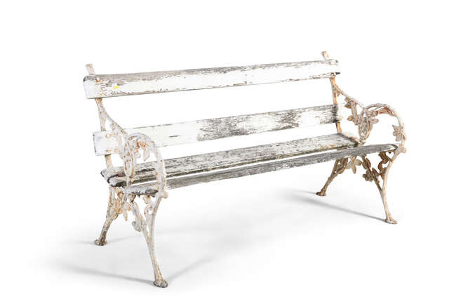 A VICTORIAN WHITE PAINTED CAST IRON GARDEN BENCH,...