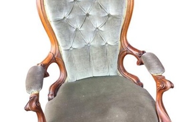 A Victorian mahogany button upholstered spoonback armchair, with moulded...