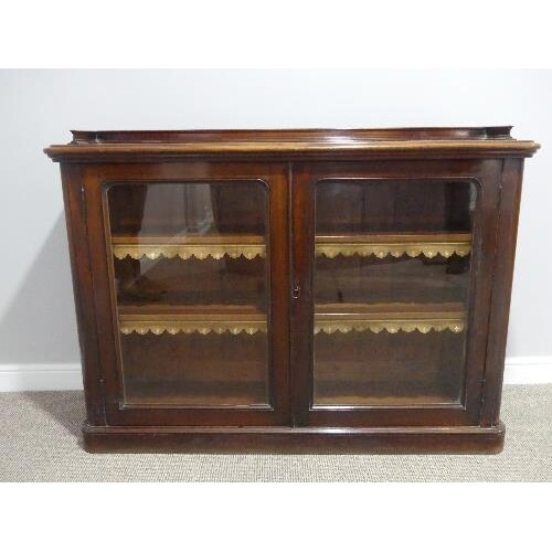 A Victorian mahogany two door glazed Bookcase, the two adjus...