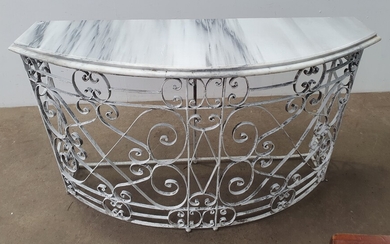 A WROUGHT IRON BASED MARBLE TOP CONSOLE