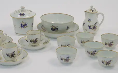 A Worcester porcelain part tea service, c.1785, decorated with gilt-highlighted blue flowers...