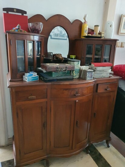A carved teak sideboard with oval mirror anddrawers circa 1920's - 1930's