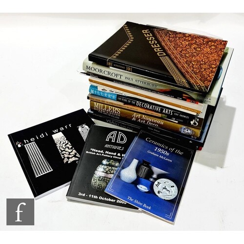 A collection of assorted reference books and exhibition pamp...