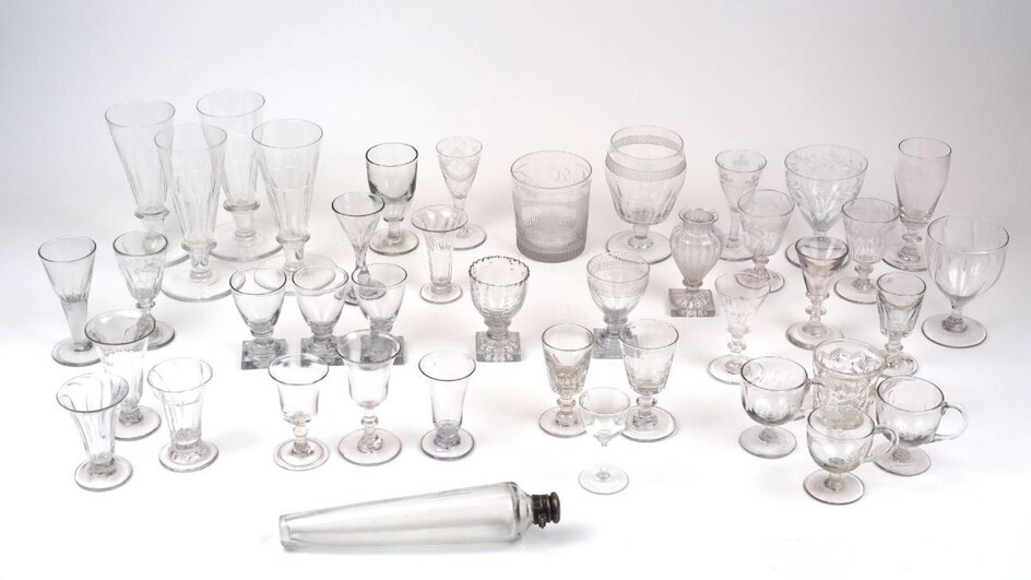 A collection of drinking glasses, 19th century and later, to include: a tumbler engraved with an image of Sunderland Bridge with collier brig passing under and initials G.O. to the reverse, 10cm high, two small engraved glasses, one engraved with...