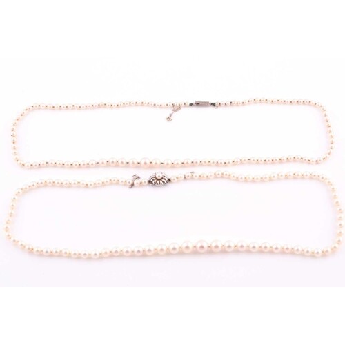 A cultured pearl necklace with white metal clasp, together w...
