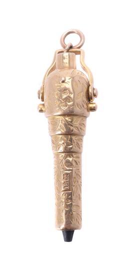 A gold coloured watch key in the form of a cannon