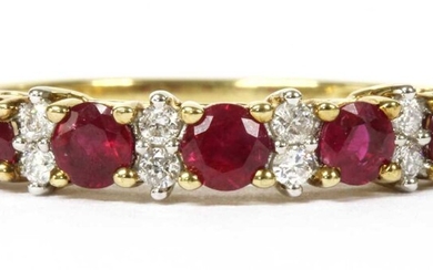A gold ruby and diamond half eternity ring