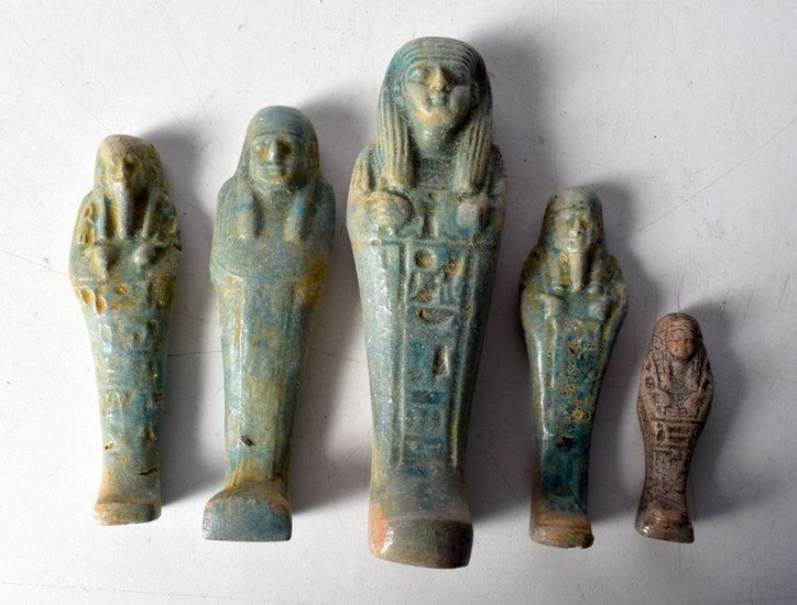 A group of Egyptian glazed pottery Sarcophagus figures. Largest 15cm (5).
