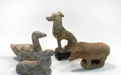 A group of four Chinese pottery animal figures, Han/Tang Dynasty
