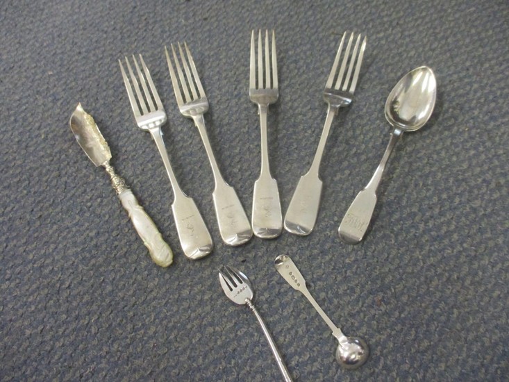 A group of silver flatware to include a mustard spoon Locat...