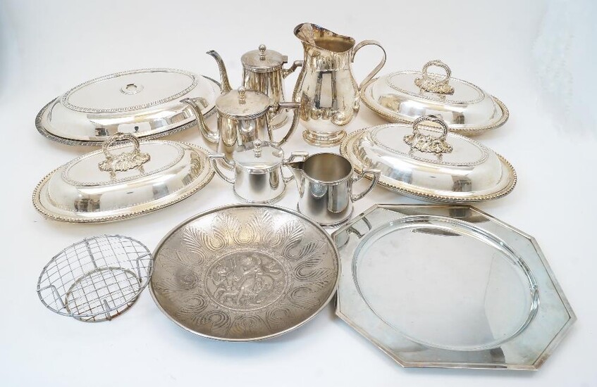 A group of silver plate, comprising: a four piece tea service, by St Hilaire, comprising a teapot, hot water pot, twin handled sugar bowl and cover, and a milk jug; a water jug, 21cm high; three oval serving dishes and covers with beeded rims and...