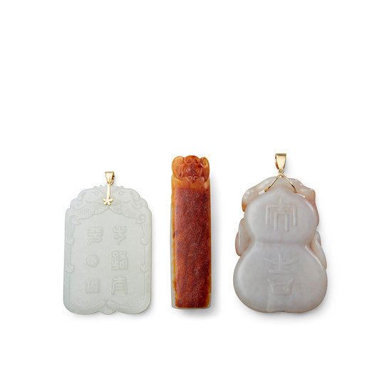 A group of three carved jade decorations