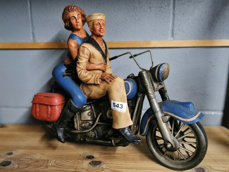A large composition model of a motorcycle and riders, H. 38cm.