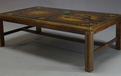 A large reverse printed glass and brass bound coffee table,...