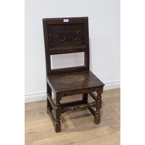 A late 17th Century oak Manchester type Chair with leafage c...