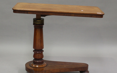A late Victorian mahogany adjustable reading table, height 72cm, width 88cm, depth 45cm.