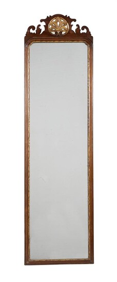 A mahogany and parcel gilt wall mirror in early George III style
