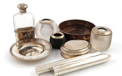 A mixed lot of silver items, various dates and makers, comprising: a modern cigar case, by Theo Fennell, London 1987, initialled, a Tiffany cigar case, a modern tobacco box by Asprey, London 1983, a wine coaster, two silver-mounted glass table vesta...