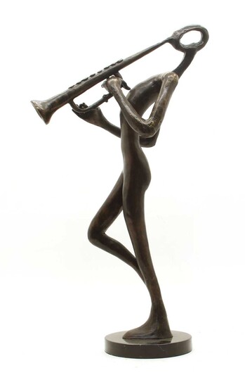A modern bronze musician figure on circular base