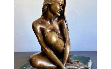A modern bronze of a seated female nude - by Manuel Vidal To...