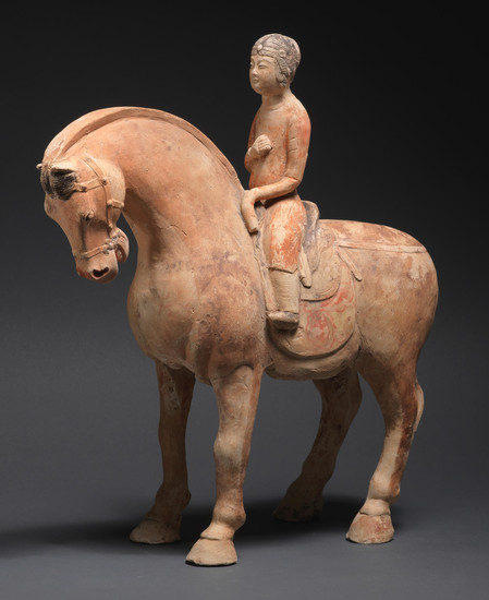 A painted pottery model of a horse and female entertainer