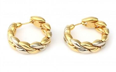 A pair of 18 karat two tone gold ear hoops. Designed in a link motif of white and yellow gold. Provenance: Italy. Gross weight: 20 g.