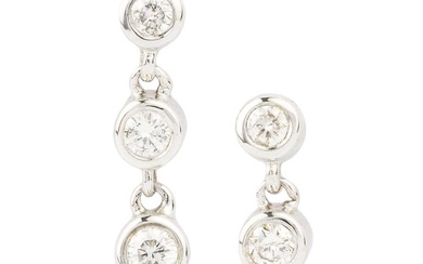 A pair of 18ct white gold and diamond earrings, each...