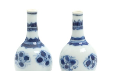 A pair of Chinese blue and white porcelain miniature vases, decorated with...