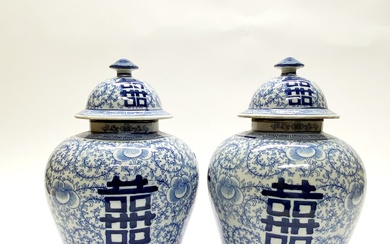 A pair of Chinese hand painted porcelain jars and lids featuring the character for double happiness H. 32cm