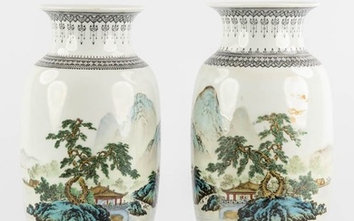 A pair of Chinese vases with a mountain landscape, 20th C. (H:24 x D:14 cm)