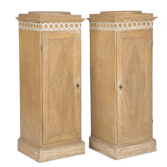A pair of Gustavian style painted pedestal cabinets. 19th century and later. H. 137 cm. W. 50 cm. D. 48 cm. (2)
