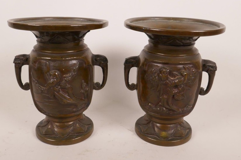 A pair of Japanese bronze vases with wide flared rims, eleph...