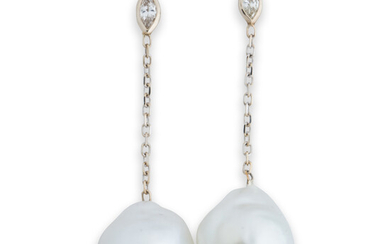 A pair of South Sea pearl, diamond and fourteen karat white gold earrings