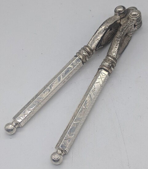 A pair of Victorian silver mounted nutcrackers, hallmarked London,...